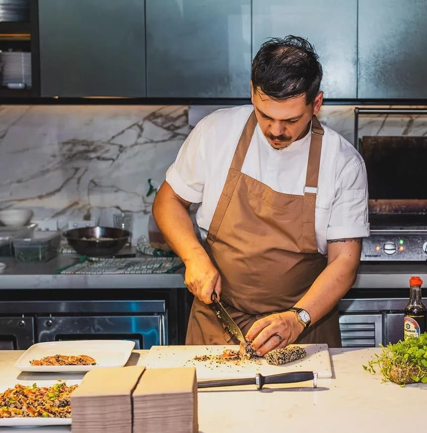 Chef Gabriele Franco plating in the kitchen
