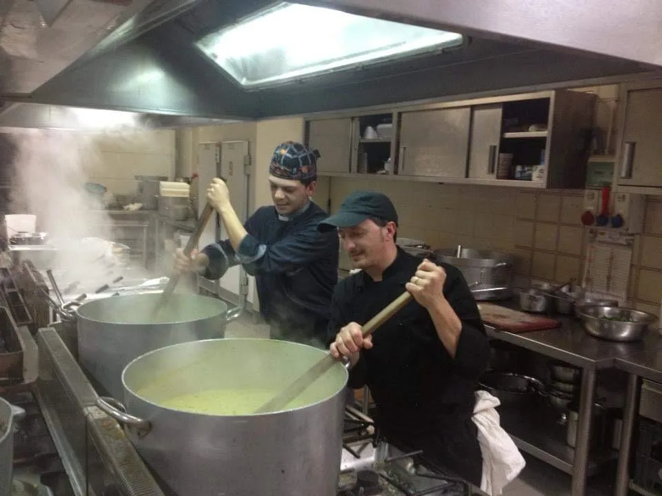 Chef Gabriele Franco cooking in a commercial kitchen